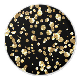 Gold polka dots on a black background .  ceramic knob