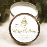 Gold Ribbon Tree Merry Christmas Script Classic Round Sticker<br><div class="desc">This modern holiday sticker features a gold ribbon Christmas tree above the words "Merry Christmas" in stylish gold-coloured calligraphy script. Personalise it with your family's name in serif font.</div>