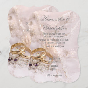 Gold rings on brides dress wedding invitation