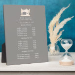Gold Sewing Machine Seamstress Grey pricing   Plaque<br><div class="desc">Understated design displays your services, price list or business information beneath an illustration of a vintage sewing machin in faux gold over a Grey taupe background and your name or business name. Includes three customisable headings and body text fields. To adjust layout, enter your text and then use the Customise...</div>