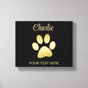 Gold Shiny Dog Paw on black background Canvas Print