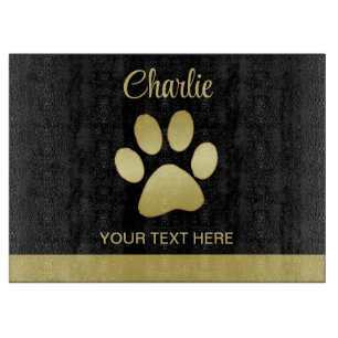 Gold Shiny Dog Paw on black background Cutting Board