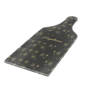 Gold snowflakes on grey cutting board