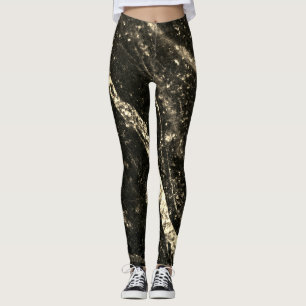Gold sparkly line on black rock leggings