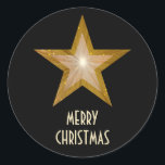 Gold Star 'Merry Christmas'' round sticker black<br><div class="desc">Modern design with a 'shining' gold and white star on a black background. Sticker with a gold and white customisable design for you to personalise with your own text, images and ideas. The text can easily be changed using the template provided or click the 'Customise It' button to make further...</div>