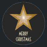 Gold Star 'Merry Christmas'' round sticker black<br><div class="desc">Modern design with a 'shining' gold and white star on a black background. Sticker with a gold and white customisable design for you to personalise with your own text, images and ideas. The text can easily be changed using the template provided or click the 'Customise It' button to make further...</div>
