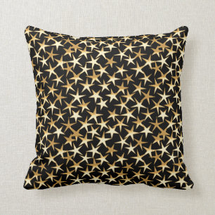 Gold stars on a black background cushion
