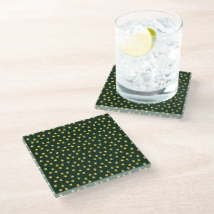 Gold stars on green glass coaster