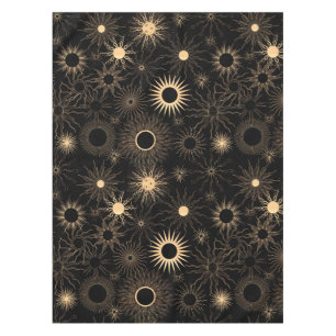 Gold suns graphic pattern on black tablecloth