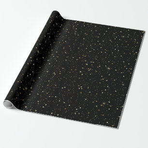 Gold tome glitter and sparkles on black wrapping paper