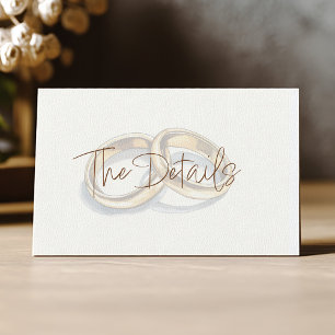 Gold wedding rings background the details enclosure card
