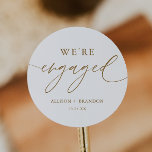 Gold We're Engaged Engagement Party Favours Classic Round Sticker<br><div class="desc">Gold We're Engaged Engagement Party Favours Stickers
Engagement Celebration Decorations</div>