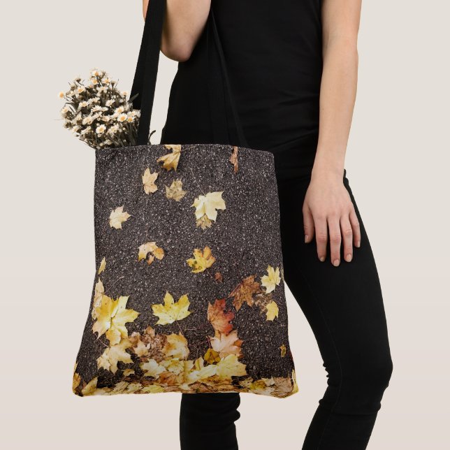 Gold yellow maple leaves autumn asphalt road tote bag (Close Up)