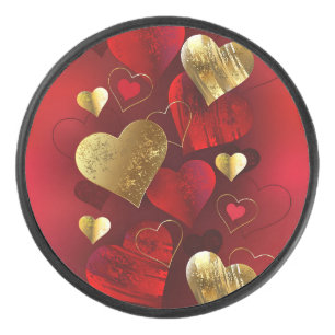 Golden and red valentines hockey puck