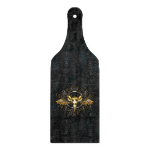 Golden Bird Skull on Black background Cutting Board