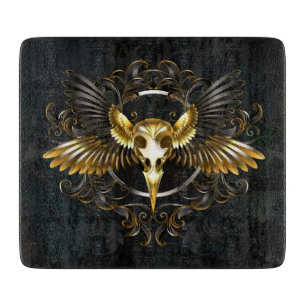 Golden Bird Skull on Black background Cutting Board