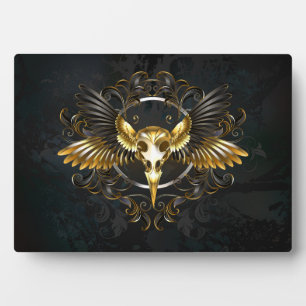 Golden Bird Skull on Black background Plaque