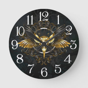 Golden Bird Skull on Black background Round Clock