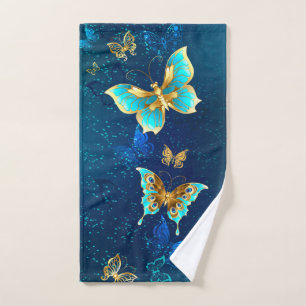 Golden Butterflies on a Blue Background Hand Towel
