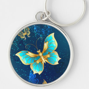 Golden Butterflies on a Blue Background Key Ring