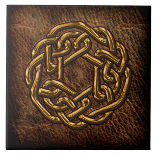 Golden celtic knot on leather tile