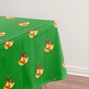 Golden Christmas Bells on Green Tablecloth