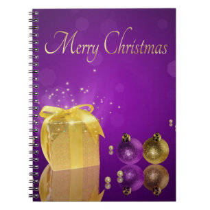 Golden Christmas Gift Box on Purple Lavender Notebook