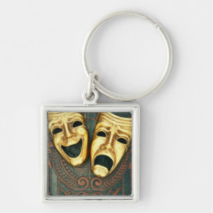 Golden comedy and tragedy masks on patterned key ring