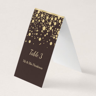 Golden confetti on brown Table number, place card