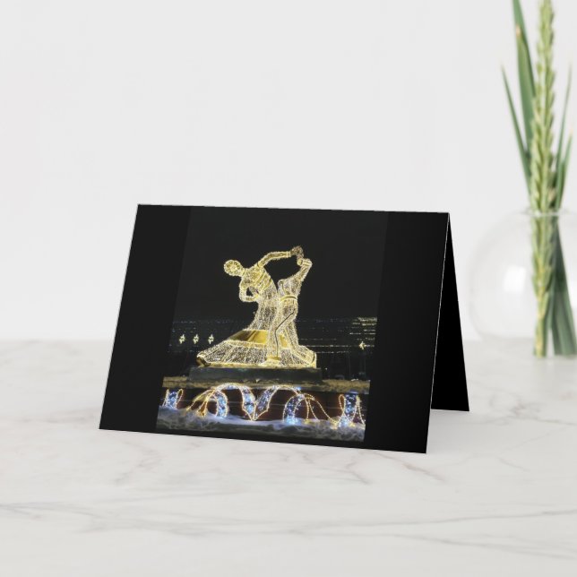 Golden dancing figures on black card (Front)