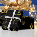 Golden Decorations on Black Christmas Wrapping Paper<br><div class="desc">Unveil the ultimate in holiday chic with our Golden Decorations on Black Christmas Wrapping Paper. This striking design offers a dramatic and sophisticated alternative to traditional festive colours. A deep black background provides the perfect canvas for an array of glittering gold Christmas trees, classic holly and berries, bright stars, and...</div>