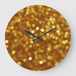 Golden defocused glitter, sparkling texture. large clock