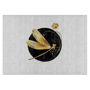 Golden dragonfly in black circle cutting board