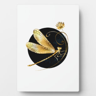 Golden dragonfly in black circle plaque