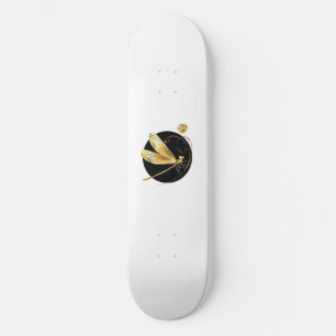 Golden dragonfly in black circle skateboard