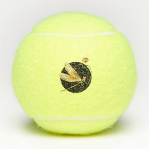 Golden dragonfly in black circle tennis balls