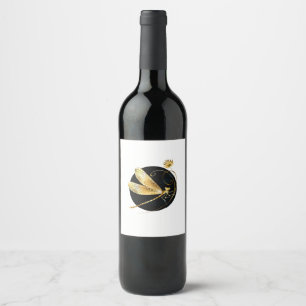 Golden dragonfly in black circle wine label