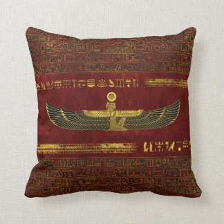 Golden Egyptian God Ornament on red leather Cushion