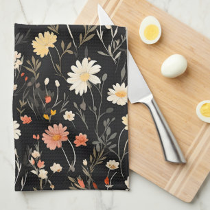 Golden flowers on a dark background tea towel