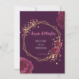 golden frame with flowers on a burgundy  invitation