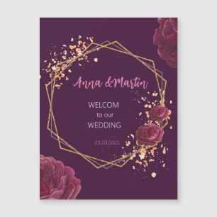 golden frame with flowers on a burgundy magnetic invitation