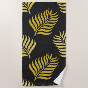 Golden leaves on black background beach towel
