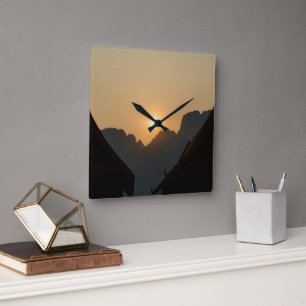 Golden light on the peaks: sunset in Vang Vieng Square Wall Clock