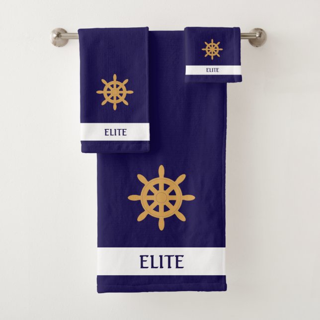 Golden nautical wheel on navy blue bath towel set (Insitu)