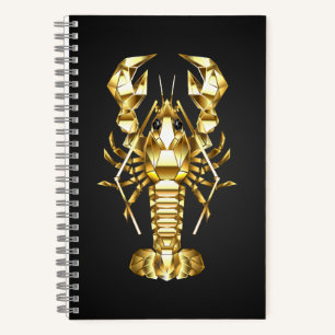 Golden polygonal lobster crawfish on black notebook