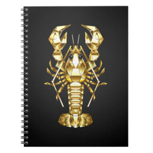 Golden polygonal lobster crawfish on black notebook