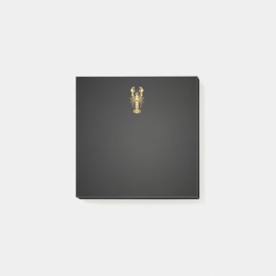 Golden polygonal lobster crawfish on black post-it notes