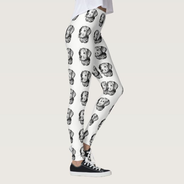 Golden retriever puppy portrait in black and white leggings (Right)