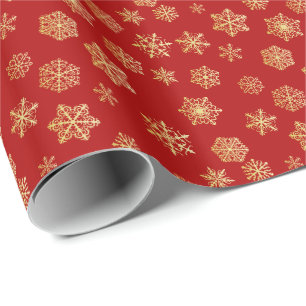 Golden snowflakes on a red background wrapping paper