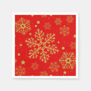 Golden snowflakes on red napkin